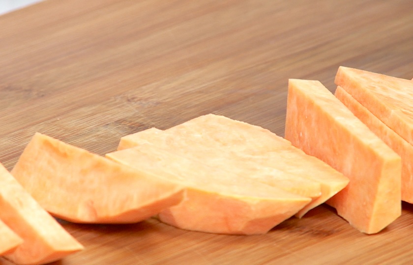 Peel 2 sweet potatoes and cut them