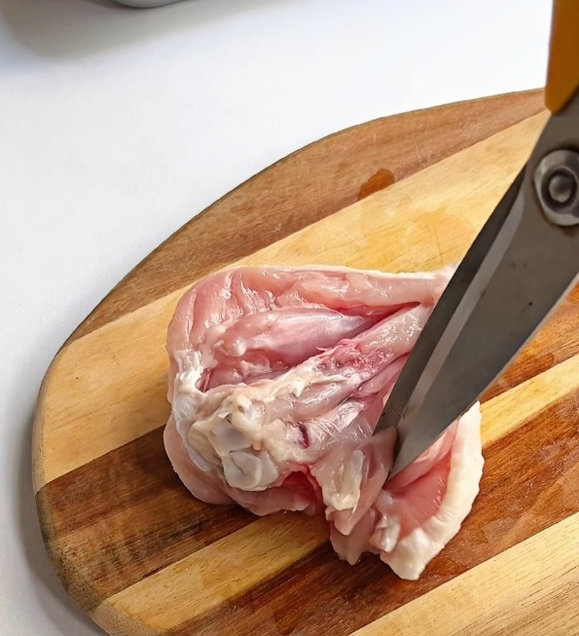 Cut the chicken legs with scissors